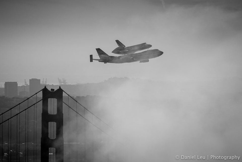 Space shuttle endeavour on top of the Shuttle Carrier Aircraft (SCA) over San Francisco on its way to retirmenet.