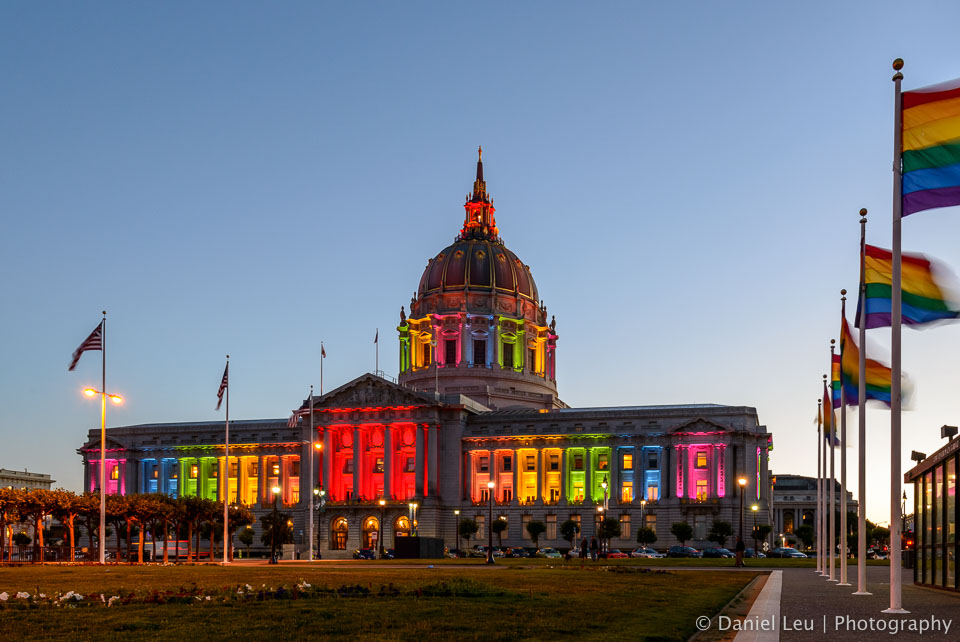 Rainbow flags and rainbow colored City Hall