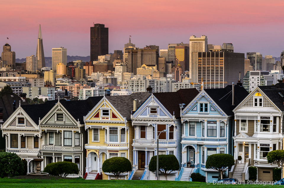 One of so many iconic postcard scenes in San Francisco: the view from Alamo Square with the colorful Victorians in the foreground and the skyscrapers of the financial district in the background.